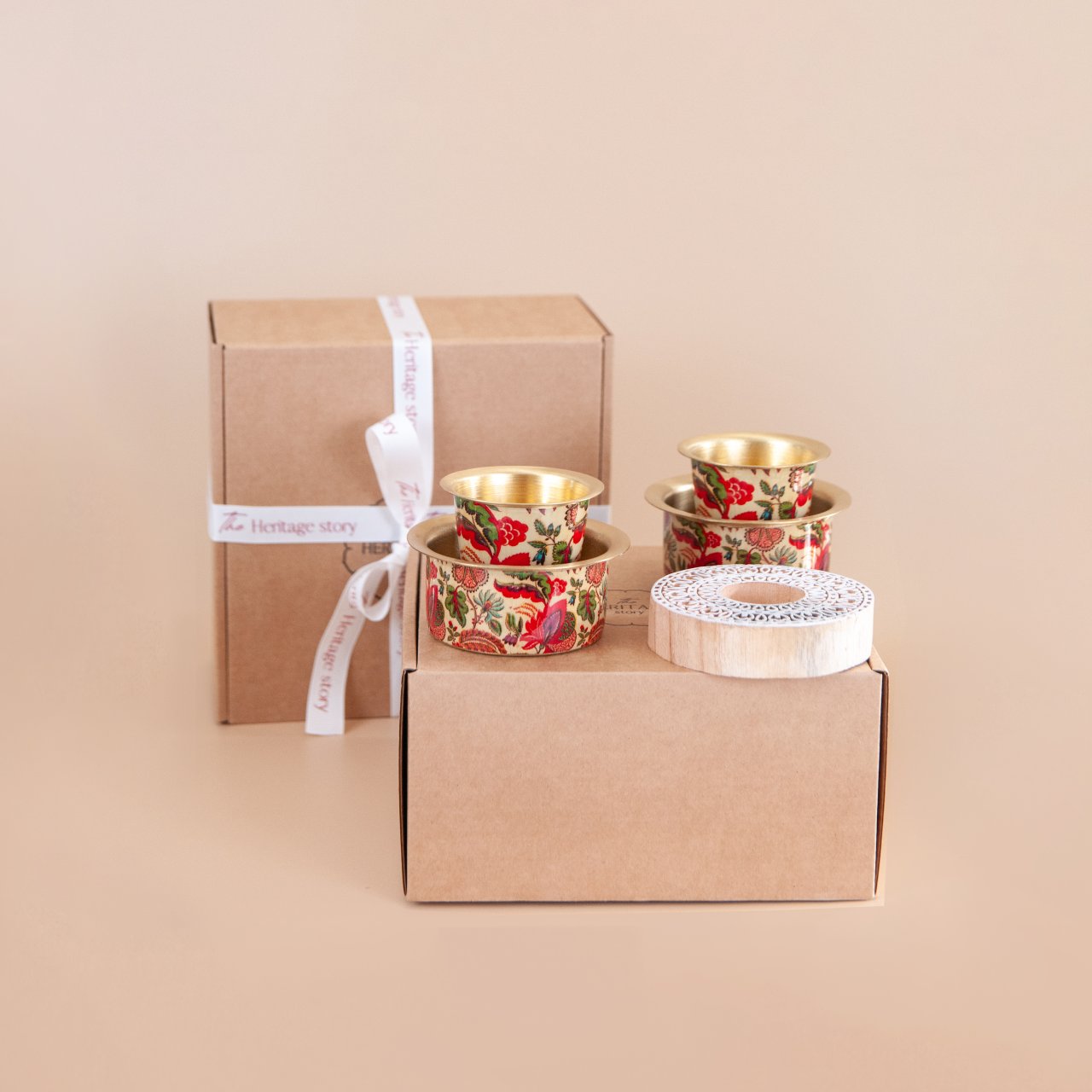 Two brass enameled filter coffee set with a wooden blockprint tealight in a gift box with a ribbon.